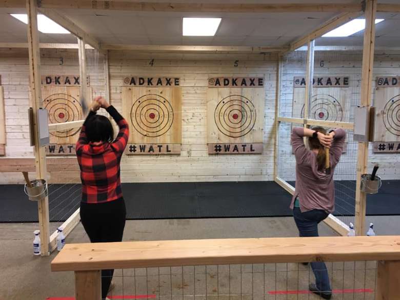 women about to throw axes
