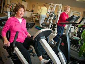 Women working out on machines