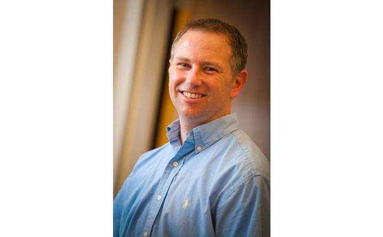Headshot of a man smiling