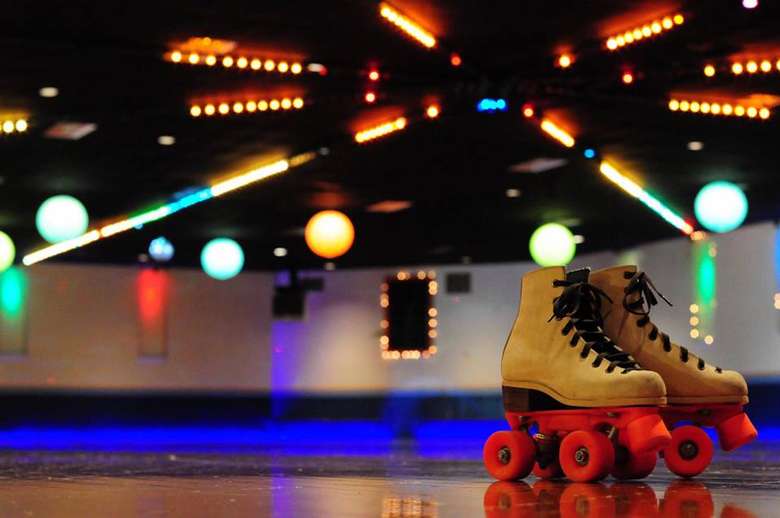 roller skates placed on rink