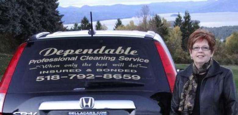 woman standing next to car with Dependable Professional Cleaning Service decal