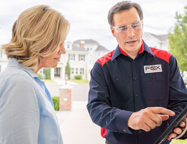 technician pointing at report