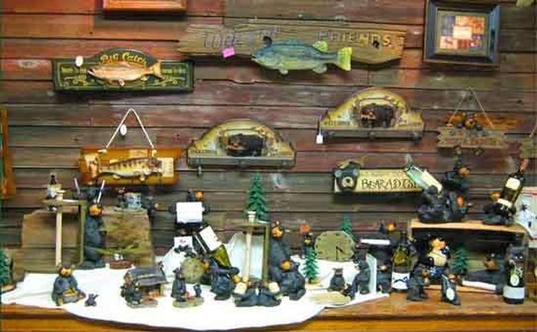 wooden fish and bear-themed signs and figurines