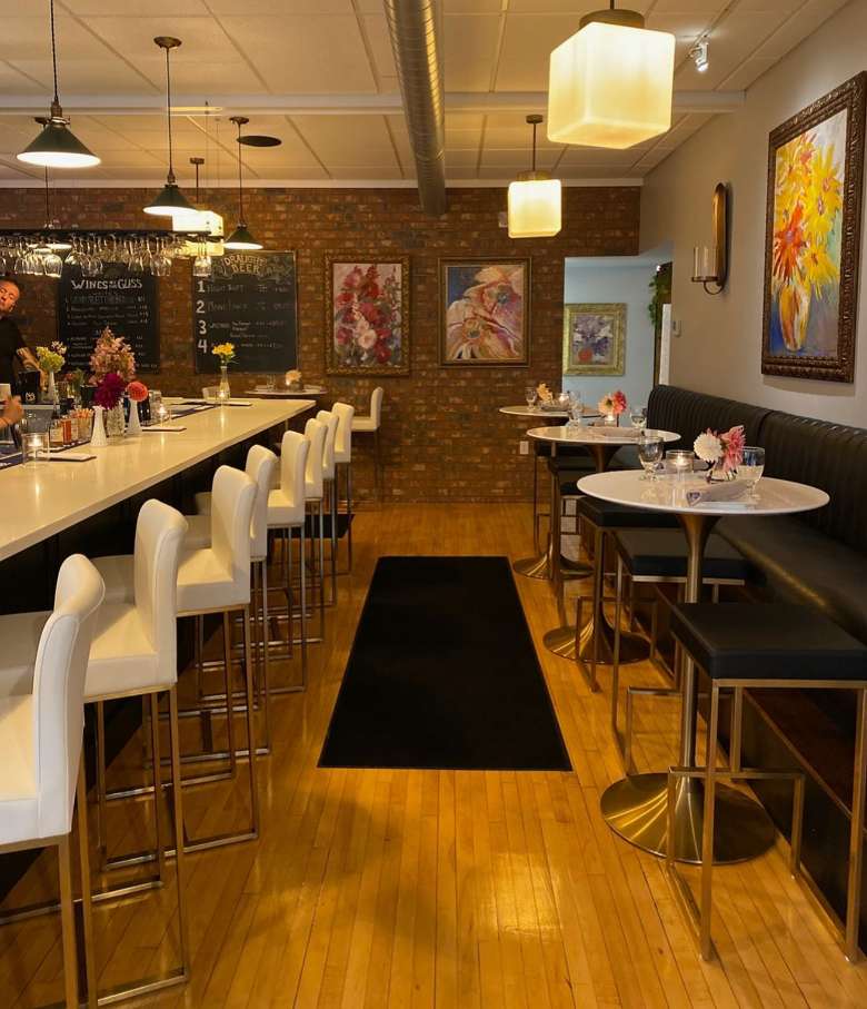 interior of a restaurant with tables and a bar