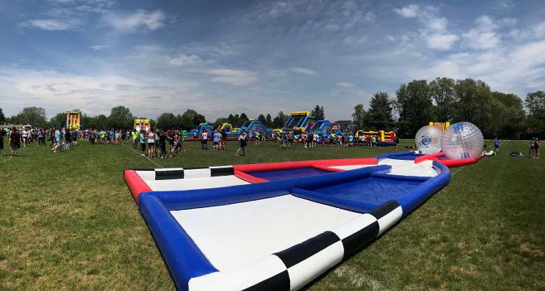 inflatable ball game set up in a grassy field