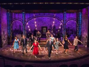 people perform on stage