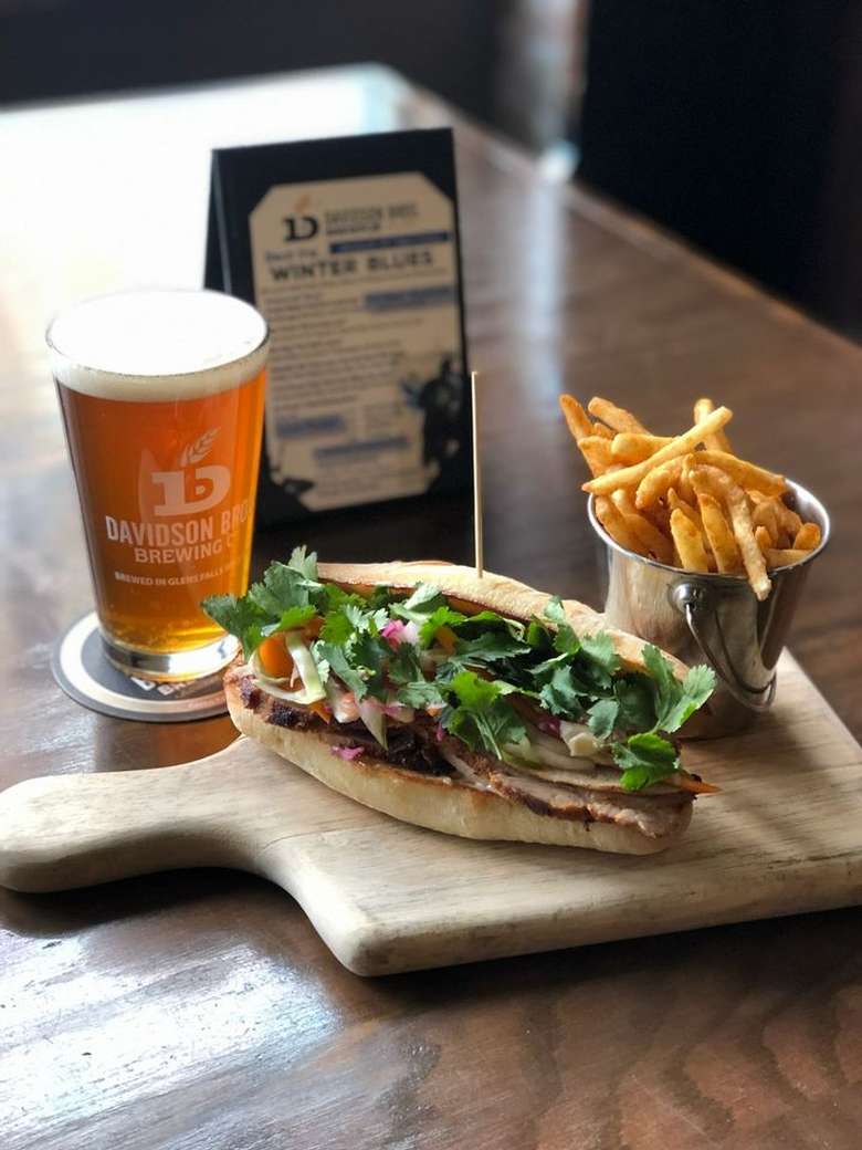 fries, sandwich, and a glass of beer