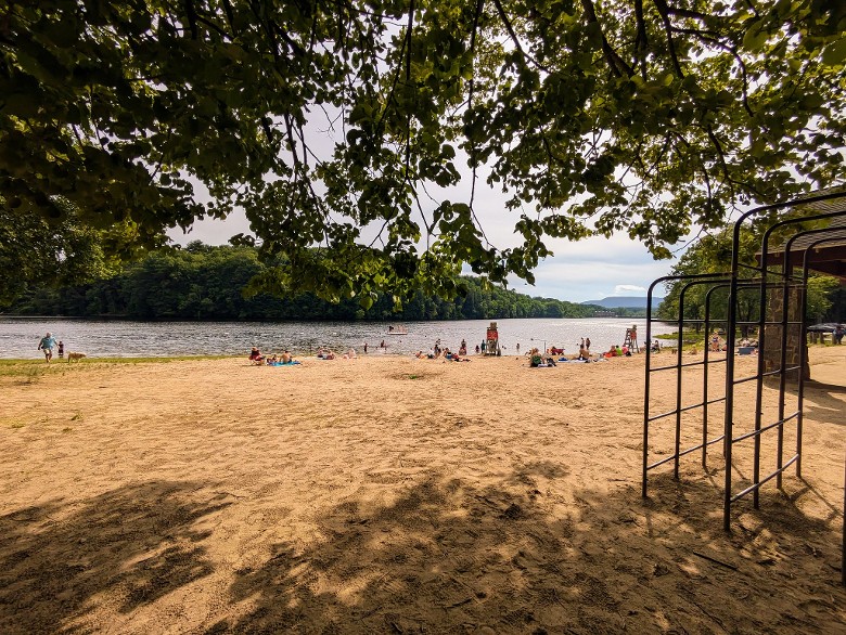 people on beach and playground at haviland cove