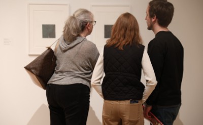 Visitors view artwork at The Hyde Collection