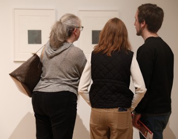 Visitors view artwork at The Hyde Collection