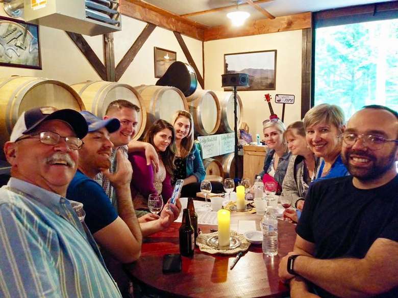 group of wine tasters in a wine tasting room