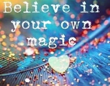 background of a blue feather, with glitter and the words "Believe in your own magic"