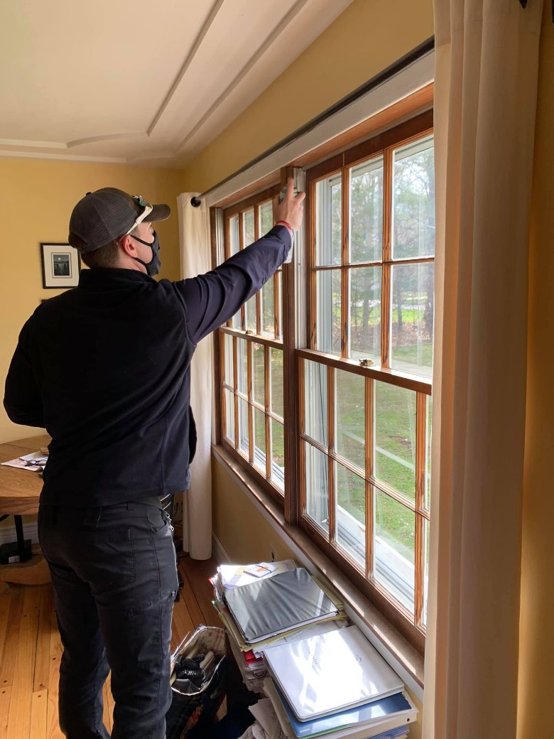 man doing pest control in house