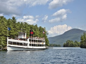 the mohican cruise ship driving past islands on lake george