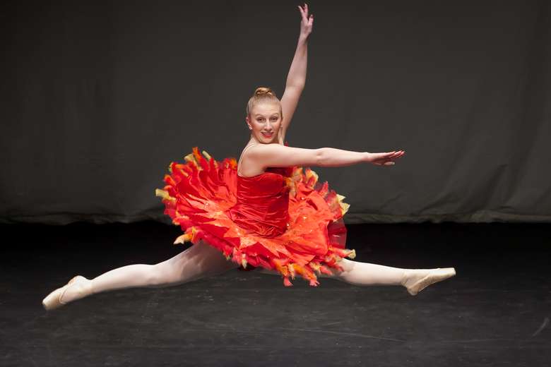 Girl jumping in the air in a split