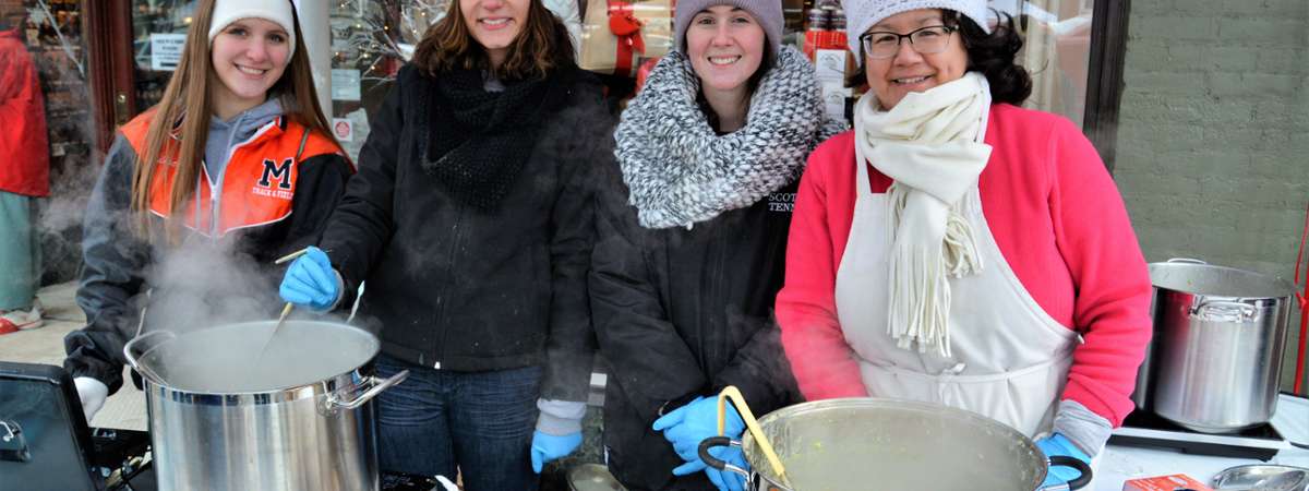 four women at Chowderfest table