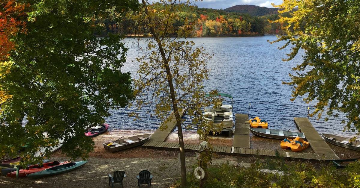 beach with watercraft at elms waterfront cottages