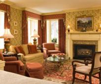 bed and breakfast room with cocktails and fire in fireplace