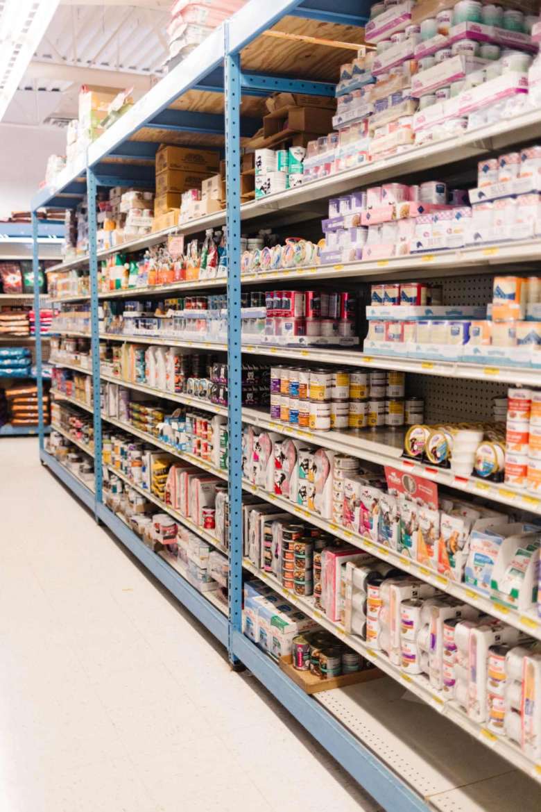 aisle in pet shop with food cans