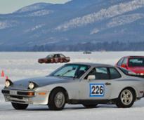 cars racing on a frozen lake