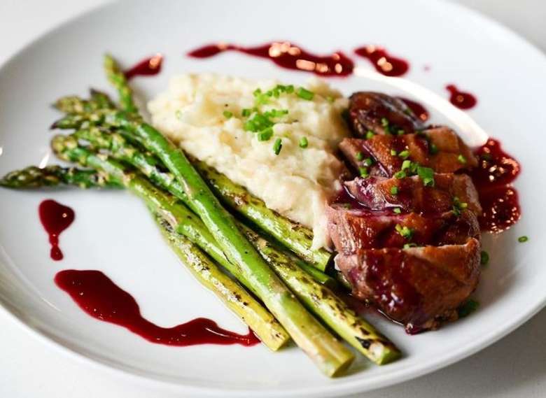 dinner of beef, mashed potatoes, and asparagus