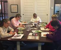 women doing a craft at the conkling center
