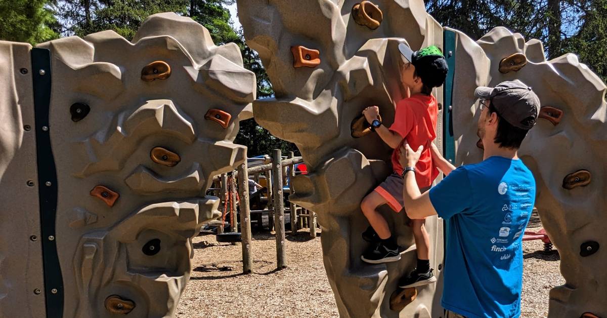 kid on climbing wall at crandall park
