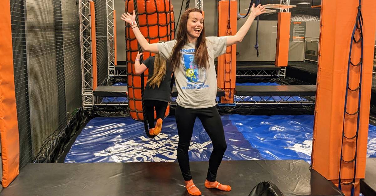 adult woman poses at sky zone ninja challenge