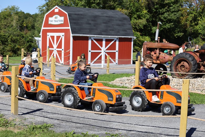 kids on pedal tractors