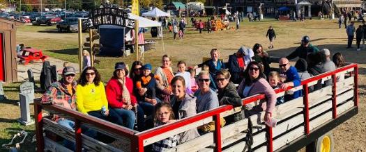 fall event near glens falls - west mountain's fall fest, people in wagon ride