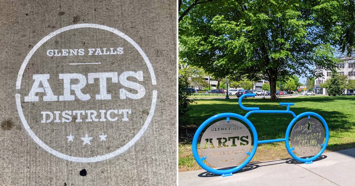 on the left, Glens Falls Arts District sidewalk stamp, on the right, blue bicycle-shaped bike rack