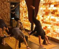 people doing yoga in a salt cave