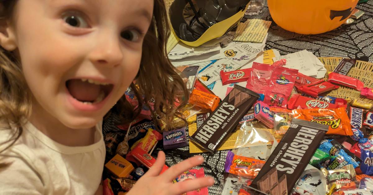 little girl excited about her halloween candy