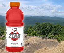 image of red gatorade over hiking photo