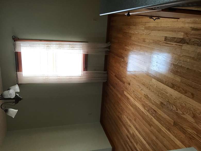 Empty and clean room with hardwood floors