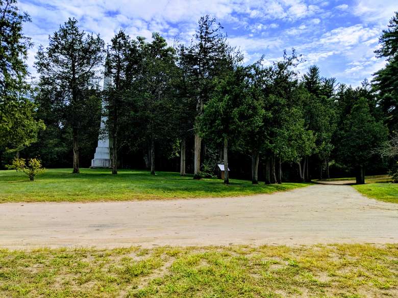 Path with trees and monument in the back