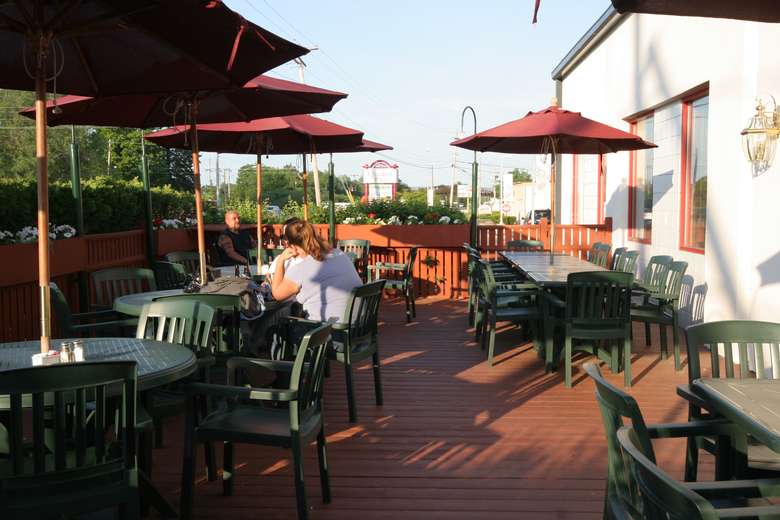 outdoor patio seating area with umbrellas at o'tooles