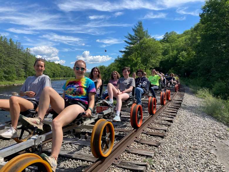group of campers on railbikes