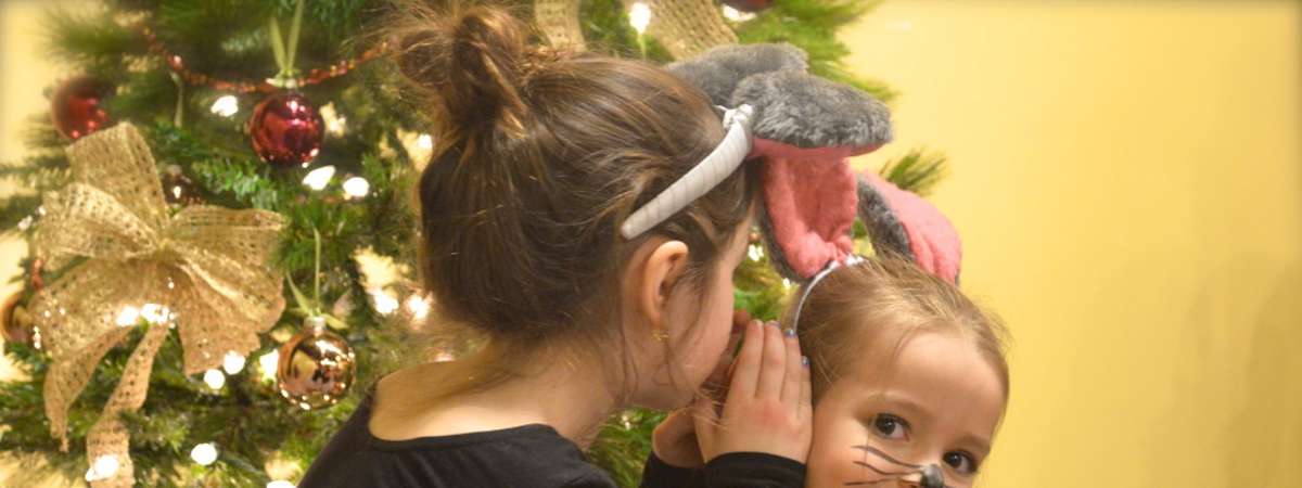 two girls dressed as mice for the holidays