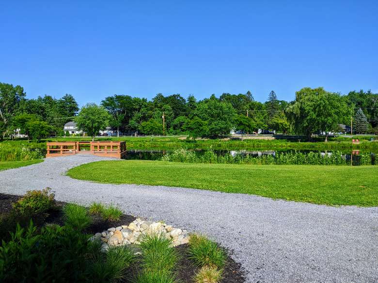 fishing pier and pond in park