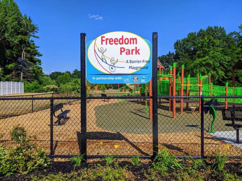 freedom park sign in front of playground