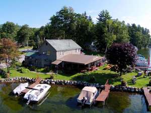 An aerial view of the restaurant showing the surrounding lake, docks and boats.