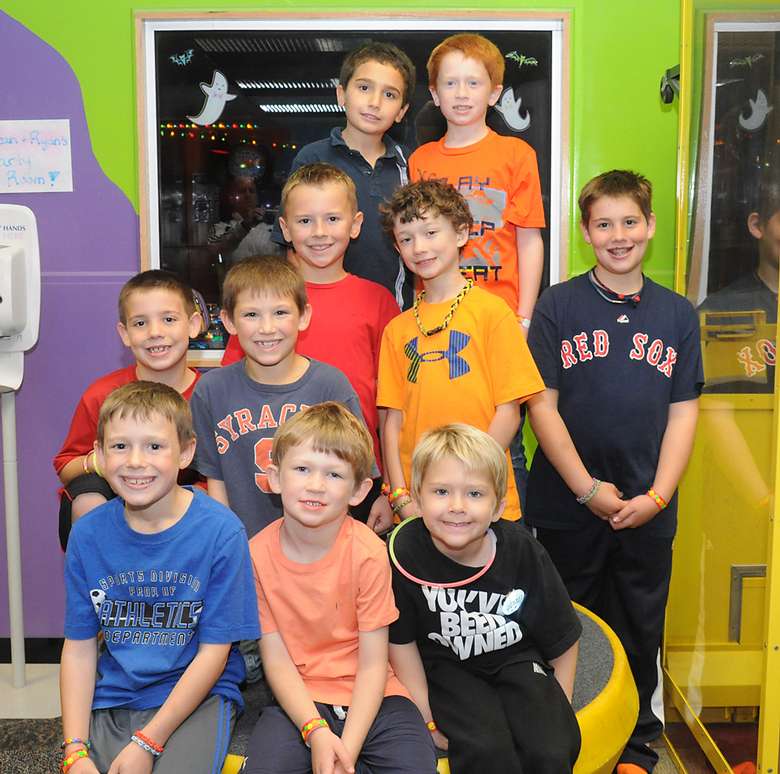 ten young boys posing together