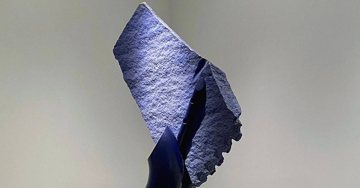 grayish purple sculpture on display