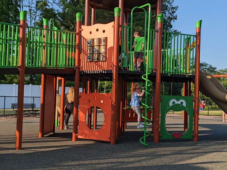 two little kids play on playground