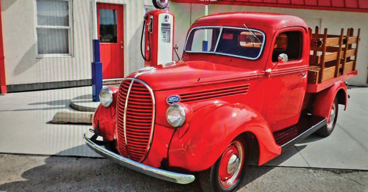 classic red car by classic gas pump