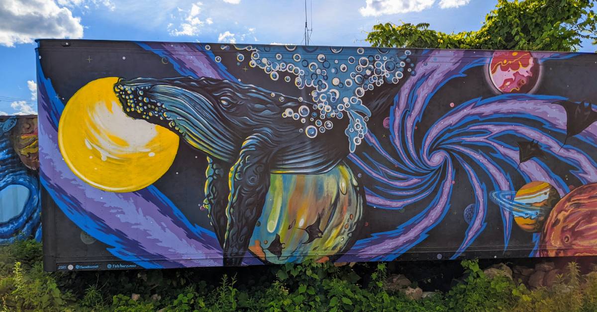 mural of a whale in space