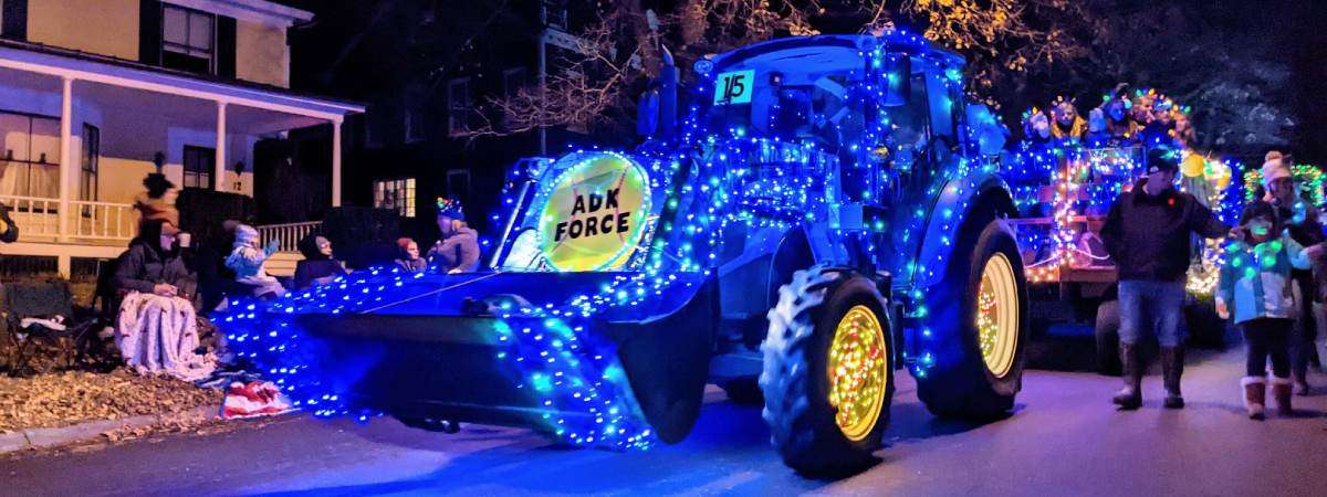 tractor lit up in blue int ractor parade