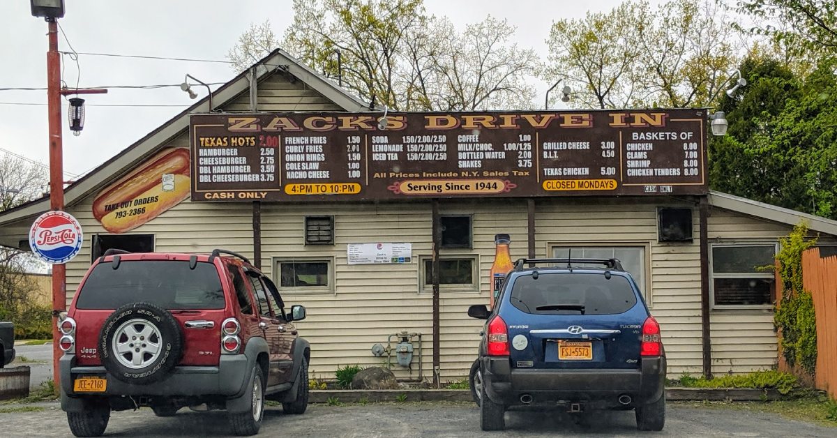 exterior of zacks drive in with menu